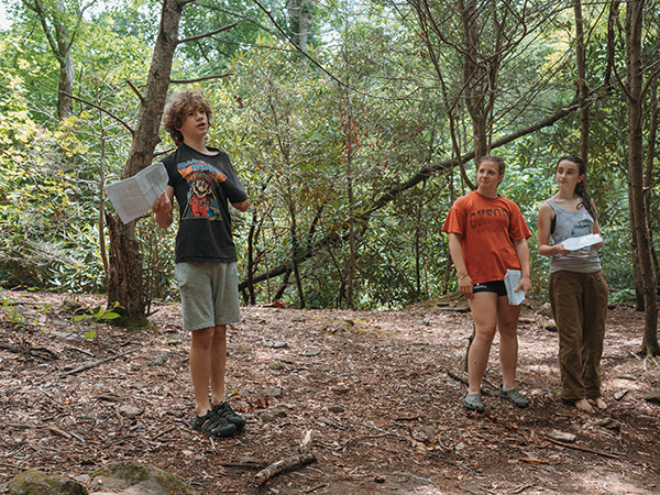 Players during a reading on the forest stage at summer theater camp