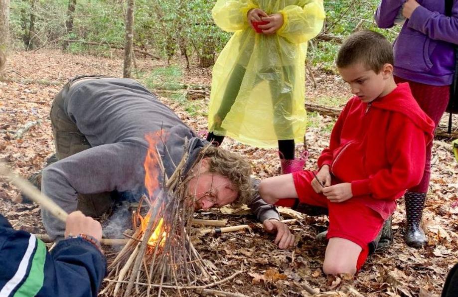 Primitive fire starting lesson complete as stacked kindling catches afire
