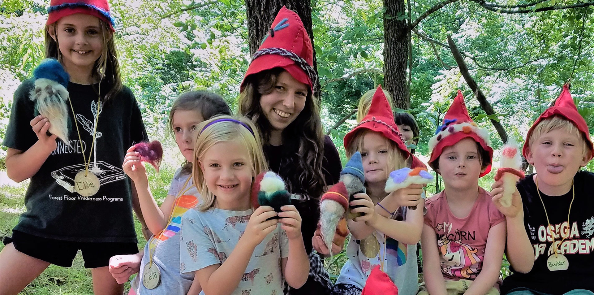 Kids dressed as forest gnomes with felted ice cream cones at Asheville summer camp in the woods