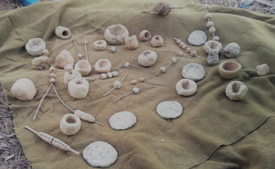 Pinch po9ts and beads made from clay at earthen pottery summer nature camp