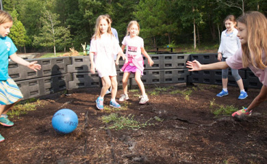 Children playing gaga ball at a youth sports summer day camp