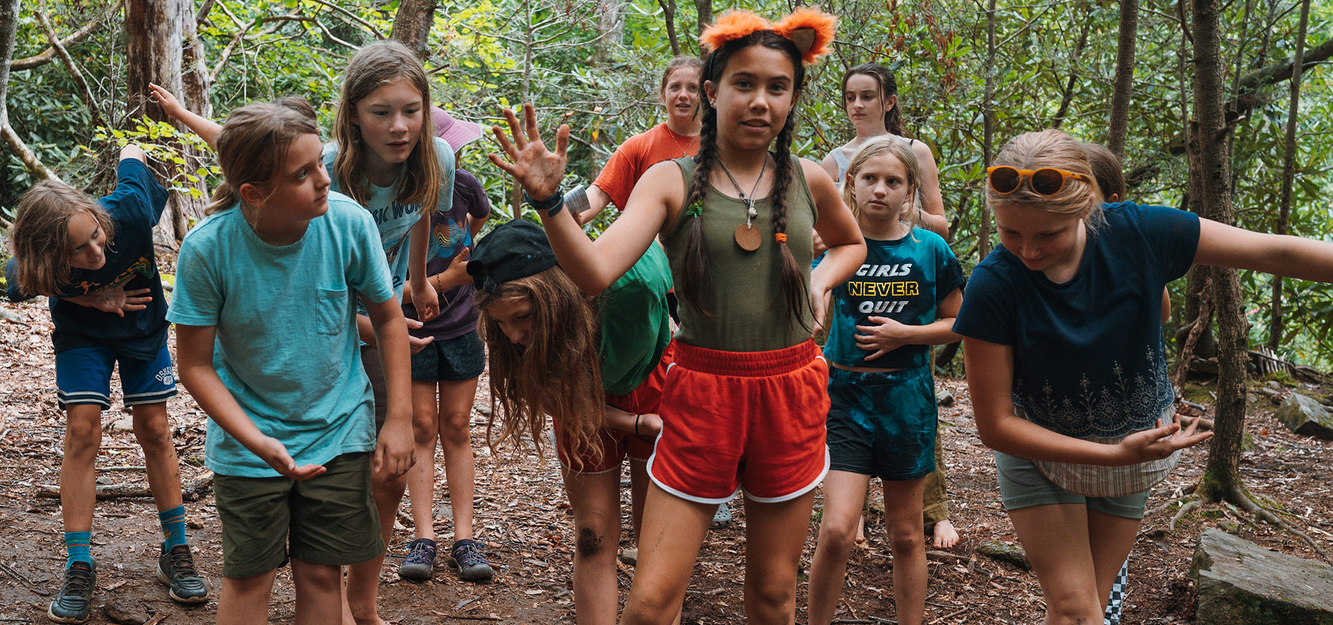 Forest Floor's summer Theater Camp players lined up and taking a bow on the forest stageerik@vikingmountainmarketing.com